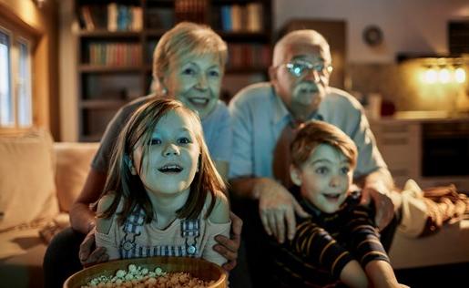 Grandparents and grandkids watching television